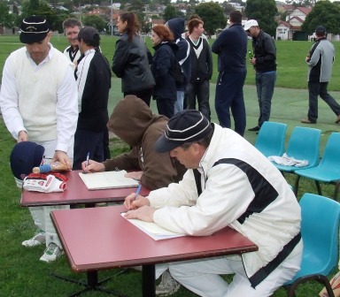 *Fellow club legend Ian Denny puts the red ink against Spud's batting innings, as team-mates and clubmates celebrate Spud's contribution to the win.